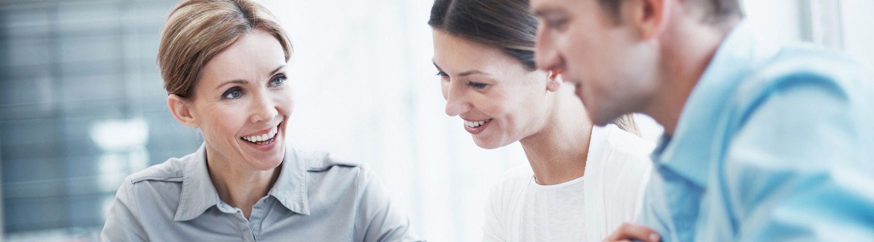 A group of three people having a meeting